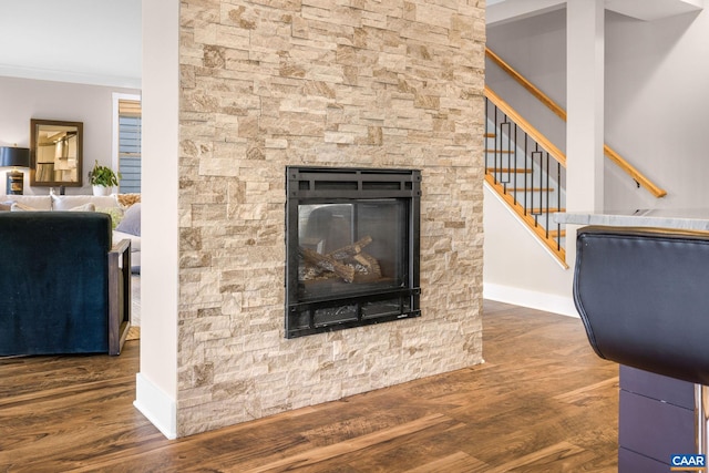 729 Highgate Row, Crozet, VA 22932 - detailed view of wood finished floors, a fireplace, baseboards, and crown molding