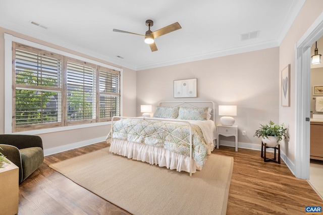 729 Highgate Row, Crozet, VA 22932 - bedroom with baseboards, wood finished floors, crown molding, ceiling fan, and connected bathroom