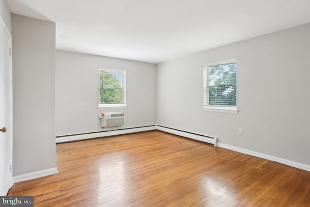 1100 Tyson Ave Unit A-10, Abington, PA 19001 - spare room featuring healthy amount of natural light, hardwood / wood-style floors, and baseboards