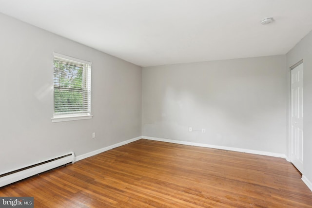 1100 Tyson Ave Unit A-10, Abington, PA 19001 - spare room featuring baseboard heating, a smoke detector, wood finished floors, and baseboards