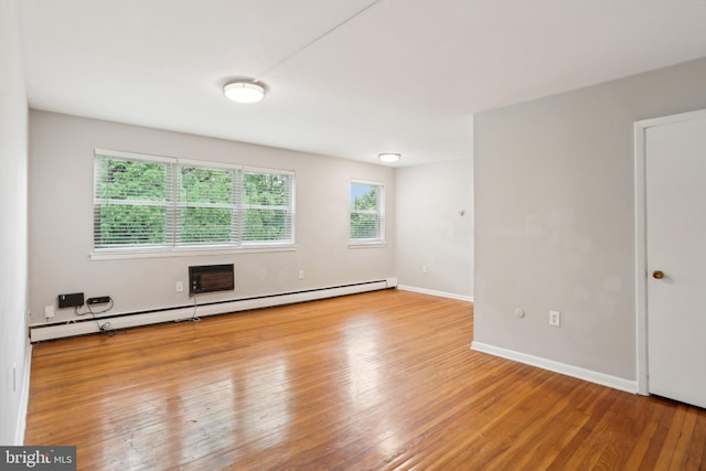 1100 Tyson Ave Unit A-10, Abington, PA 19001 - spare room featuring a baseboard heating unit, wood finished floors, and baseboards
