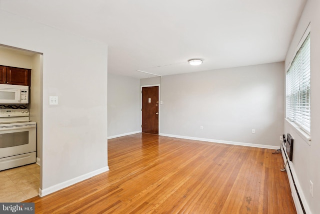 1100 Tyson Ave Unit A-10, Abington, PA 19001 - spare room featuring light wood finished floors, baseboards, and baseboard heating