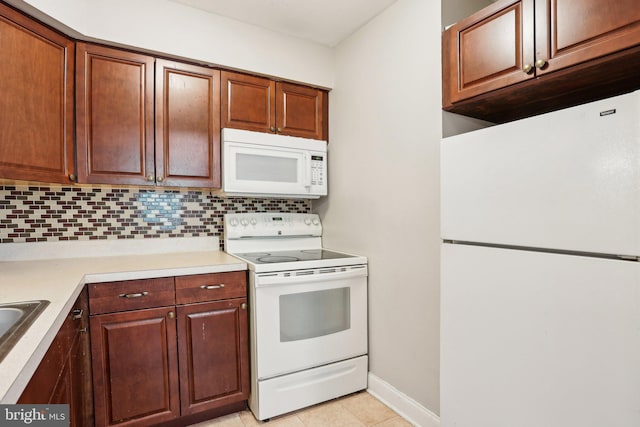 1100 Tyson Ave Unit A-10, Abington, PA 19001 - kitchen with white appliances, tasteful backsplash, light countertops, light tile patterned floors, and baseboards