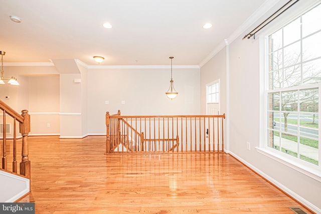 11919 Little Seneca Pkwy, Clarksburg, MD 20871 - empty room with healthy amount of natural light, ornamental molding, light wood-type flooring, a smoke detector, and baseboards