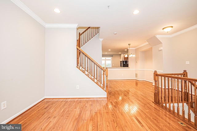 11919 Little Seneca Pkwy, Clarksburg, MD 20871 - spare room featuring light wood-type flooring, crown molding, baseboards, recessed lighting, and a chandelier