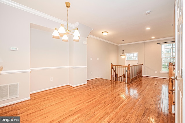 11919 Little Seneca Pkwy, Clarksburg, MD 20871 - spare room featuring wood-type flooring, ornamental molding, a chandelier, baseboards, and recessed lighting