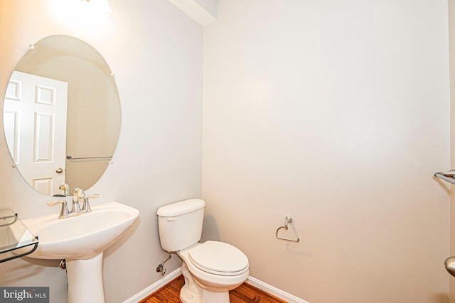 11919 Little Seneca Pkwy, Clarksburg, MD 20871 - half bath featuring wood finished floors, toilet, and baseboards