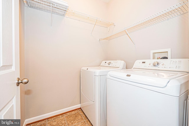 11919 Little Seneca Pkwy, Clarksburg, MD 20871 - laundry area featuring washing machine and dryer, baseboards, and light tile patterned floors