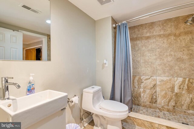 1337 Harvard St NW Unit 1, Washington, DC 20009 - bathroom with toilet, tiled shower, and vanity