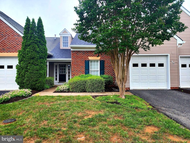 7015 Radford Dr, Fredericksburg, VA 22407 - view of front of home featuring asphalt driveway, roof with shingles, and a front yard