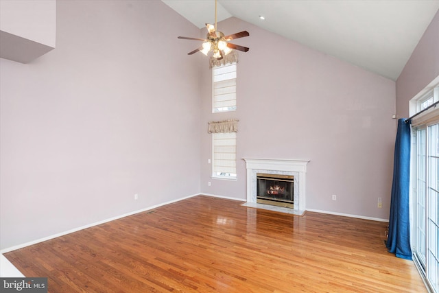 5 Primrose Dr, Burlington Township, NJ 08016 - unfurnished living room with high vaulted ceiling, light wood-style flooring, a ceiling fan, a high end fireplace, and baseboards