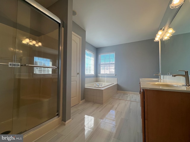 5 Primrose Dr, Burlington Township, NJ 08016 - full bathroom featuring double vanity, a garden tub, a shower stall, and baseboards
