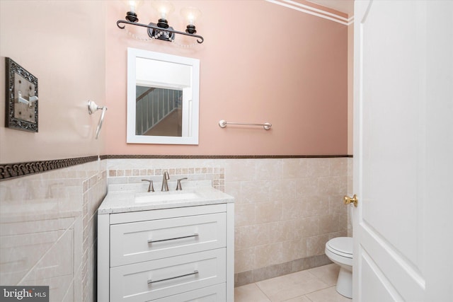5 Primrose Dr, Burlington Township, NJ 08016 - half bathroom featuring tile walls, toilet, vanity, tile patterned floors, and a wainscoted wall