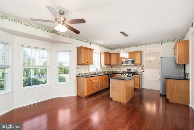 5 Primrose Dr, Burlington Township, NJ 08016 - kitchen with a center island, stainless steel appliances, dark countertops, a sink, and tasteful backsplash