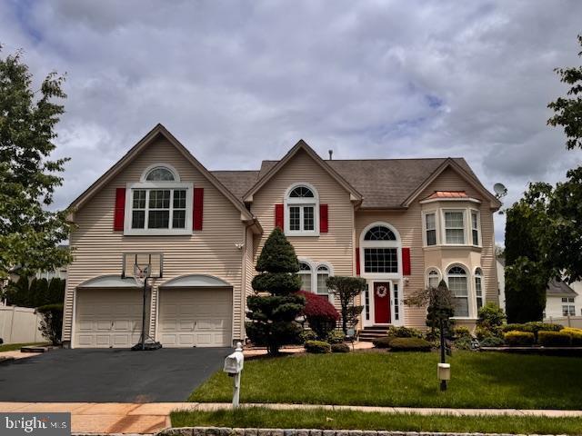 5 Wetherhill Way, Dayton, NJ 08810 - view of front facade with an attached garage, asphalt driveway, and a front lawn