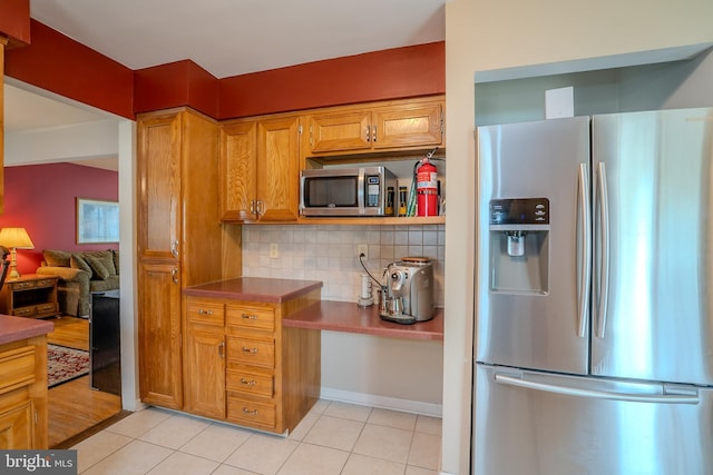 5 Wetherhill Way, Dayton, NJ 08810 - kitchen with stainless steel appliances, tasteful backsplash, light tile patterned floors, and brown cabinets