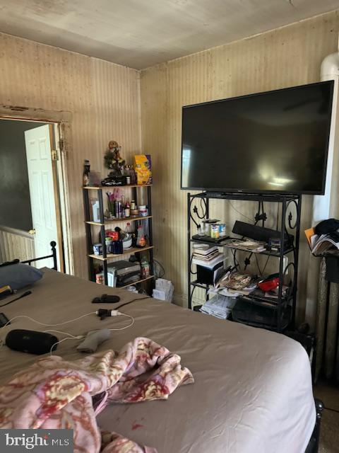 518 S 55th St, Philadelphia, PA 19143 - bedroom featuring wood walls