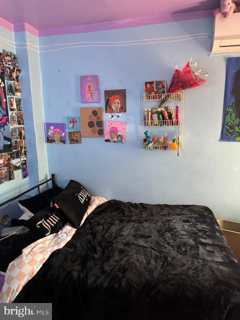 518 S 55th St, Philadelphia, PA 19143 - bedroom featuring a wall mounted air conditioner