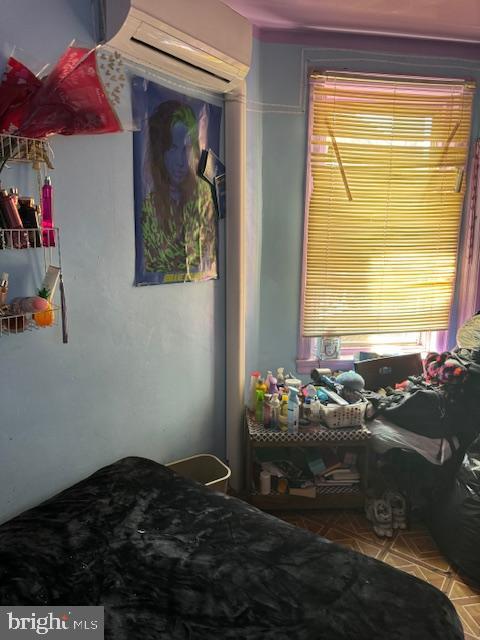 518 S 55th St, Philadelphia, PA 19143 - bedroom featuring an AC wall unit
