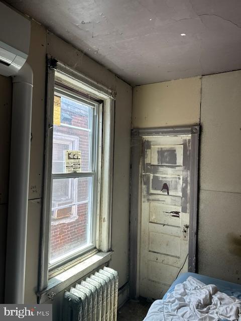 518 S 55th St, Philadelphia, PA 19143 - bedroom with radiator and a wall mounted AC
