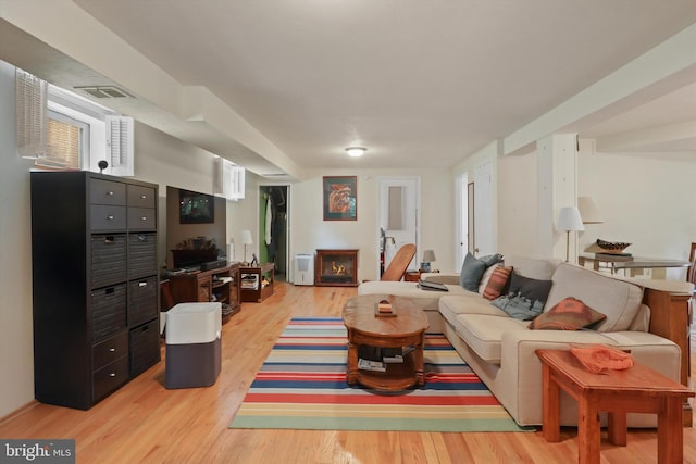 3615 22nd St N, Arlington, VA 22207 - living area featuring light wood finished floors and a lit fireplace
