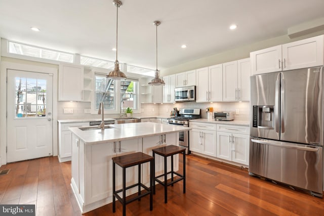 3615 10th St NW Unit A, Washington, DC 20010 - kitchen featuring stainless steel appliances, open shelves, a sink, light countertops, and recessed lighting
