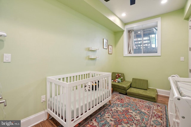 3615 10th St NW Unit A, Washington, DC 20010 - bedroom featuring baseboards, a nursery area, wood finished floors, and recessed lighting