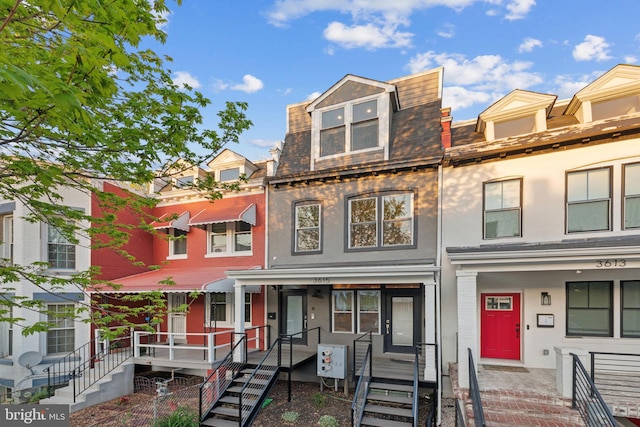 3615 10th St NW Unit A, Washington, DC 20010 - multi unit property with mansard roof, brick siding, and covered porch