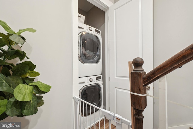 3615 10th St NW Unit A, Washington, DC 20010 - washroom with stacked washer / dryer and wood finished floors