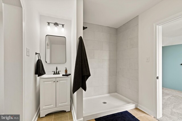 106 1st Ave, Lincoln University, PA 19352 - bathroom with vanity, tiled shower, tile patterned flooring, and baseboards