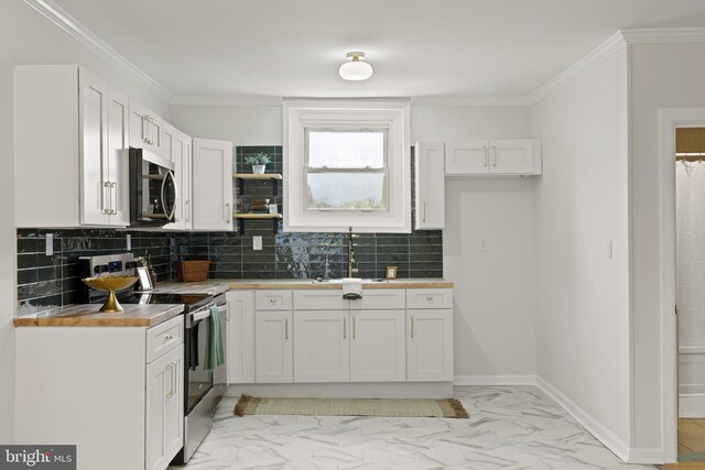 106 1st Ave, Lincoln University, PA 19352 - kitchen with stainless steel appliances, a sink, decorative backsplash, white cabinets, and ornamental molding
