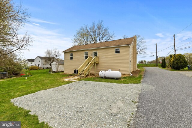 106 1st Ave, Lincoln University, PA 19352 - rear view of property featuring a lawn