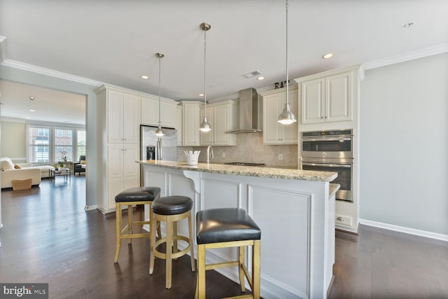 23492 Bluemont Chapel Ter, Ashburn, VA 20148 - kitchen featuring wall chimney range hood, appliances with stainless steel finishes, decorative backsplash, dark wood-style floors, and ornamental molding