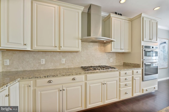 23492 Bluemont Chapel Ter, Ashburn, VA 20148 - kitchen with wall chimney exhaust hood, stainless steel appliances, dark wood-type flooring, cream cabinets, and tasteful backsplash