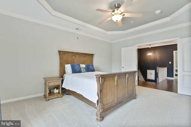 23492 Bluemont Chapel Ter, Ashburn, VA 20148 - carpeted bedroom with a tray ceiling, ornamental molding, baseboards, and a ceiling fan