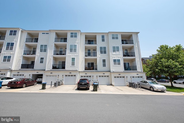23492 Bluemont Chapel Ter, Ashburn, VA 20148 - view of apartment building / complex featuring an attached garage