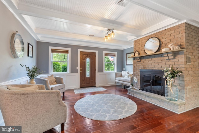 1104 N Pleasantview Rd, Pottstown, PA 19464 - living area with beamed ceiling, wood-type flooring, healthy amount of natural light, a wainscoted wall, and a fireplace