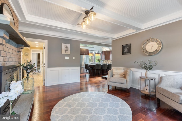 1104 N Pleasantview Rd, Pottstown, PA 19464 - living area with beam ceiling, hardwood / wood-style flooring, ornamental molding, a wainscoted wall, and a decorative wall