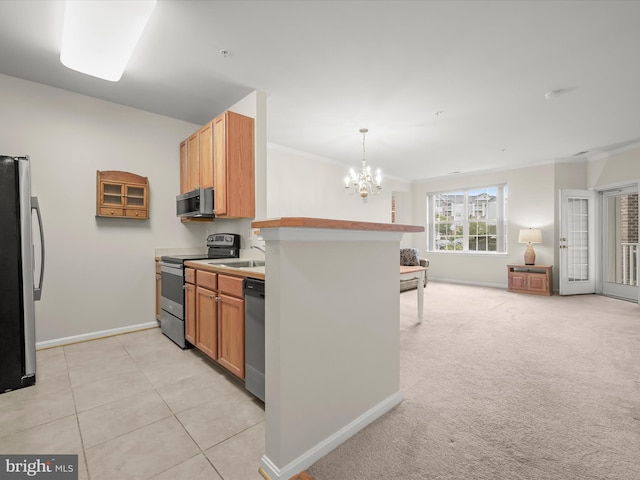 2608 Chapel Lake Dr Unit 112, Gambrills, MD 21054 - kitchen with appliances with stainless steel finishes, open floor plan, baseboards, a chandelier, and ornamental molding