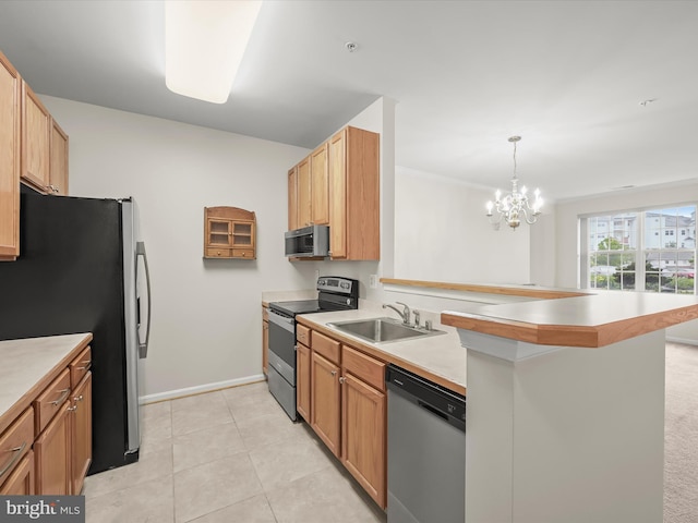 2608 Chapel Lake Dr Unit 112, Gambrills, MD 21054 - kitchen with appliances with stainless steel finishes, a sink, a peninsula, a chandelier, and baseboards