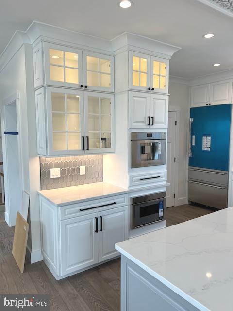 11 Selma Dr, Manahawkin, NJ 08050 - kitchen featuring oven, white cabinetry, built in microwave, decorative backsplash, and recessed lighting