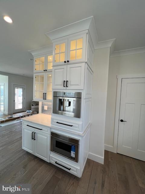 11 Selma Dr, Manahawkin, NJ 08050 - kitchen featuring stainless steel microwave, crown molding, white cabinets, dark wood finished floors, and recessed lighting