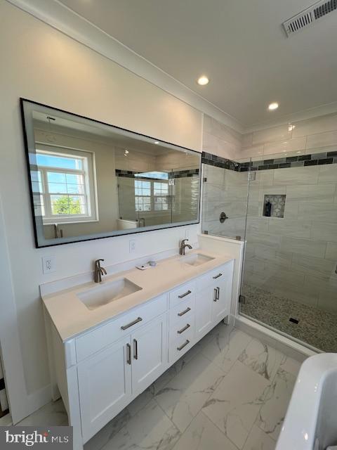 11 Selma Dr, Manahawkin, NJ 08050 - bathroom featuring a shower stall, recessed lighting, double vanity, marble look tiles, and crown molding
