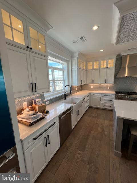 11 Selma Dr, Manahawkin, NJ 08050 - kitchen with wall chimney exhaust hood, stainless steel dishwasher, white cabinetry, light countertops, and recessed lighting