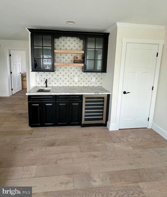11 Selma Dr, Manahawkin, NJ 08050 - indoor wet bar featuring beverage cooler, baseboards, light wood finished floors, backsplash, and ornamental molding