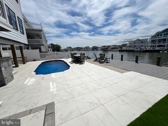 11 Selma Dr, Manahawkin, NJ 08050 - view of swimming pool with a water view, a patio area, and a boat dock