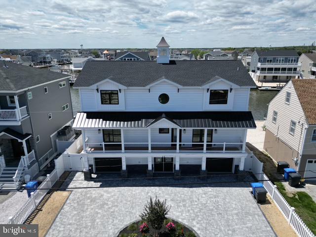11 Selma Dr, Manahawkin, NJ 08050 - view of front of home featuring decorative driveway, an attached garage, and a residential view