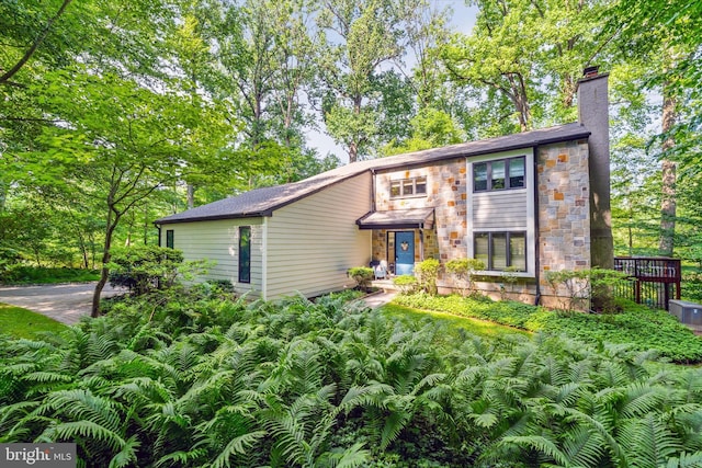59 Carter Rd, Thornton, PA 19373 - view of front facade featuring a chimney and stone siding