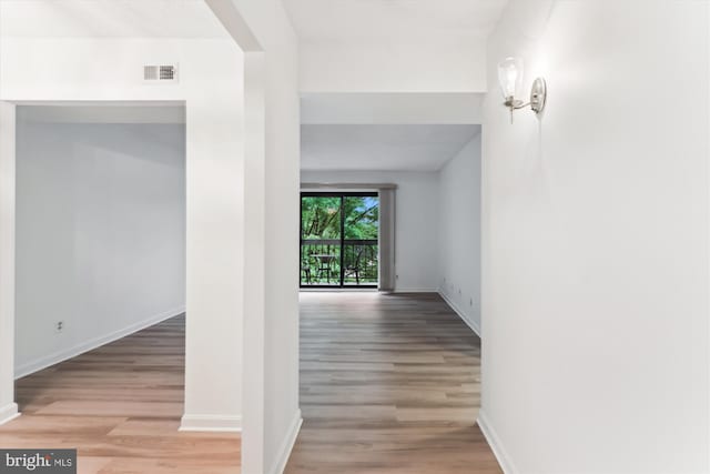 801 N Howard St Unit 305, Alexandria, VA 22304 - hallway featuring light wood finished floors and baseboards