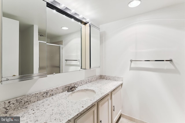 801 N Howard St Unit 305, Alexandria, VA 22304 - bathroom featuring vanity, a shower stall, tile patterned flooring, and recessed lighting